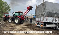 Kars’ta çamura saplanan tır, köylülerin traktörlerle yaptığı müdahale sonucu kurtarıldı