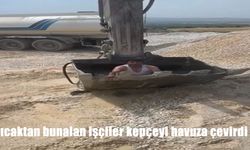 Elazığ’da işçiler sıcaktan bunalarak kepçeyi havuz yaptı