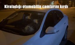 Kiraladığı otomobilin camlarını kırdı