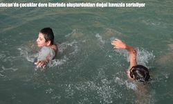 Erzincan'da çocuklar dere üzerinde oluşturdukları doğal havuzda serinliyor